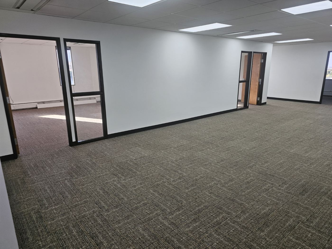 Floor 6 open area with glass-walled perimeter offices
